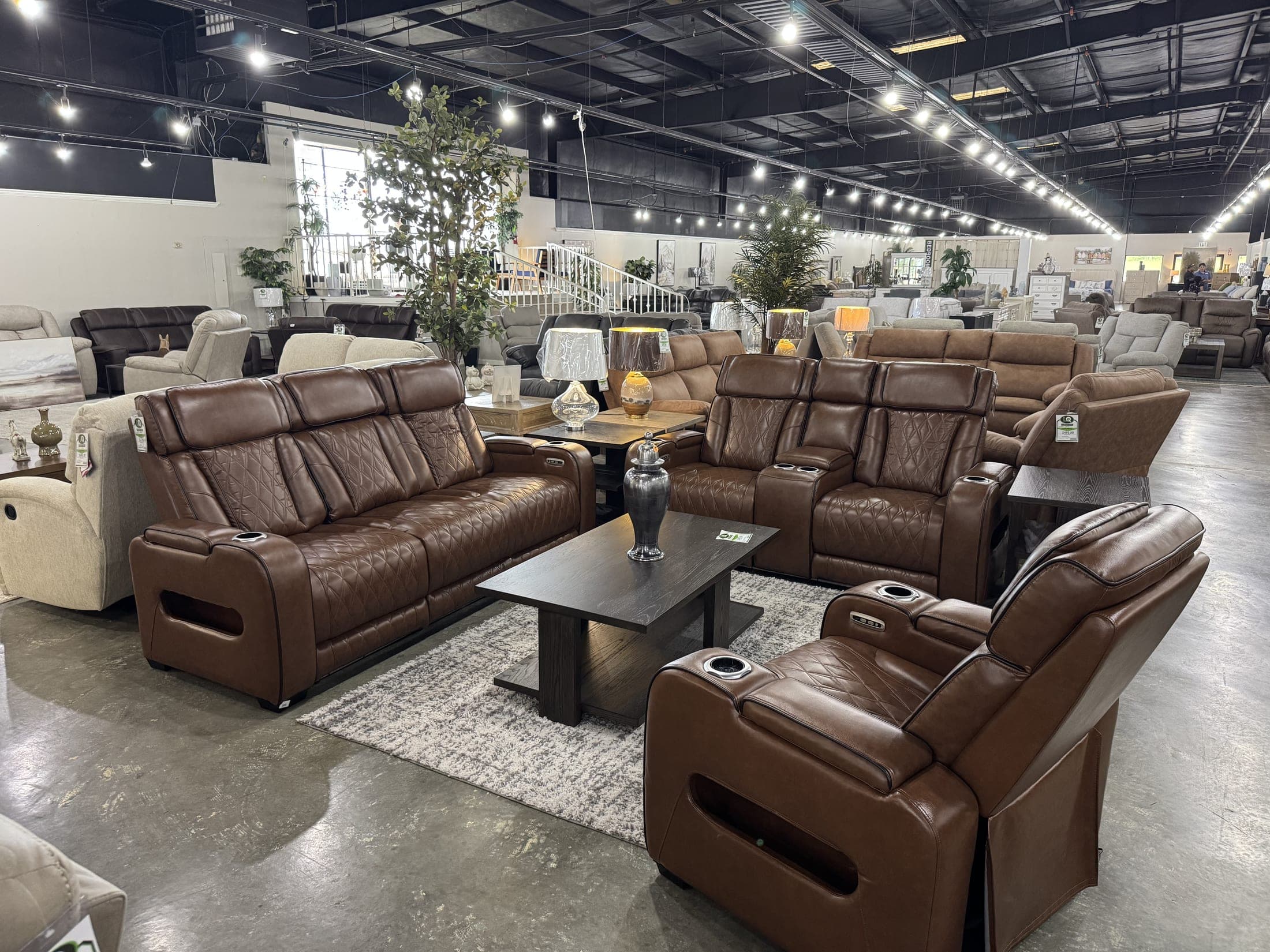Brown leather power recliners with console and cup holders