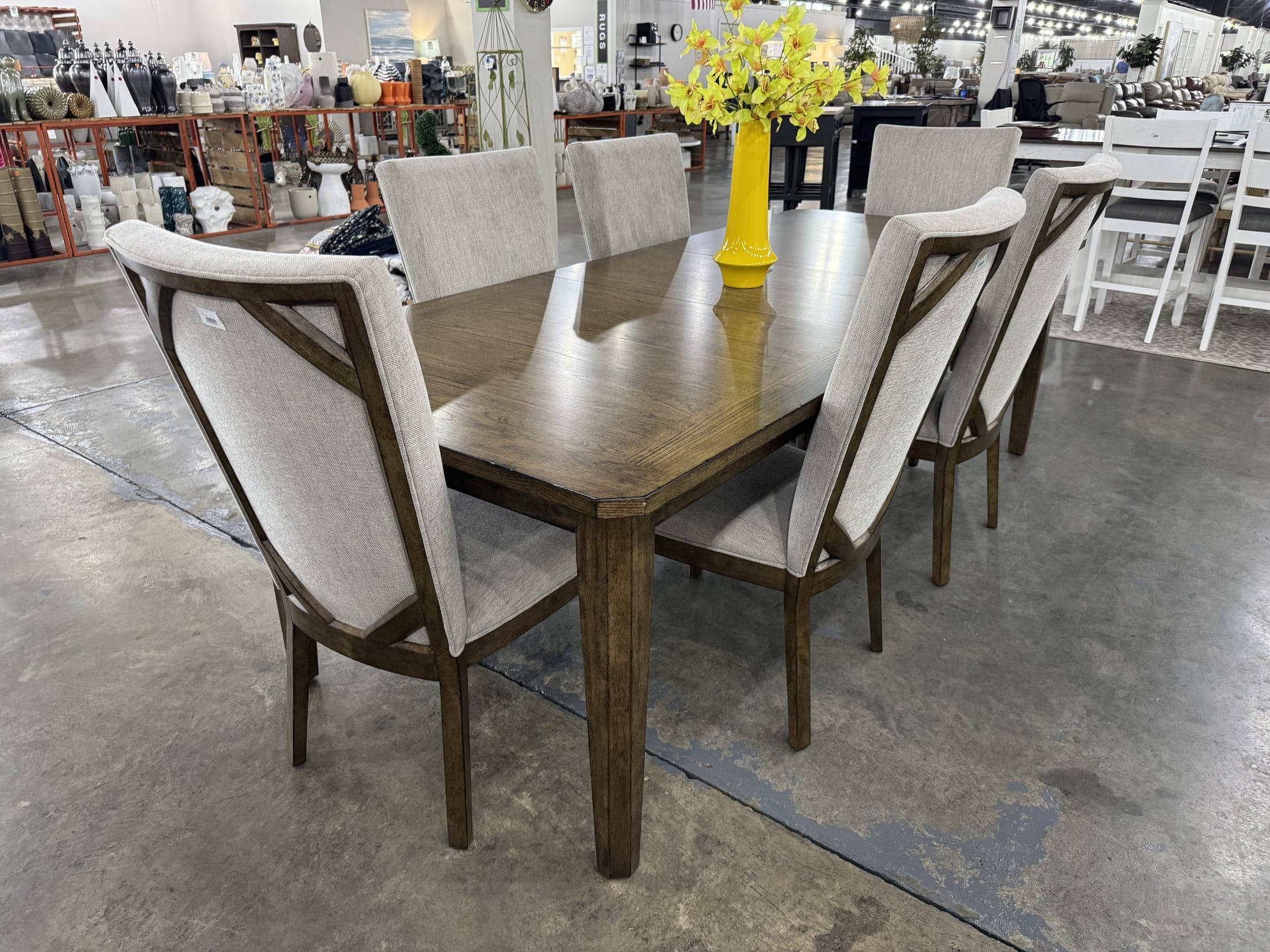 Smooth-top dining table with upholstered chairs