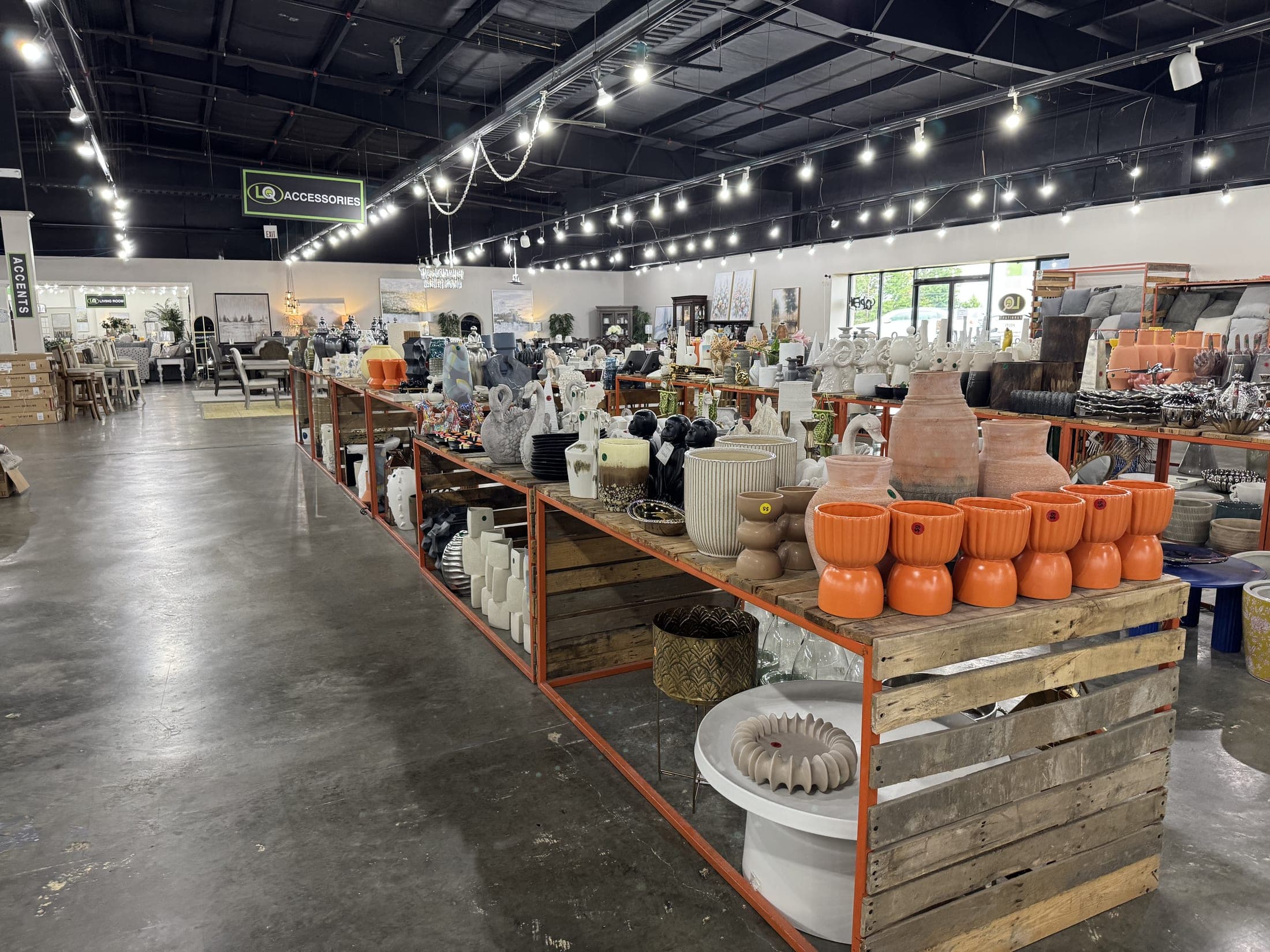 A long aisle of the LQ warehouse stacked with furniture and decor