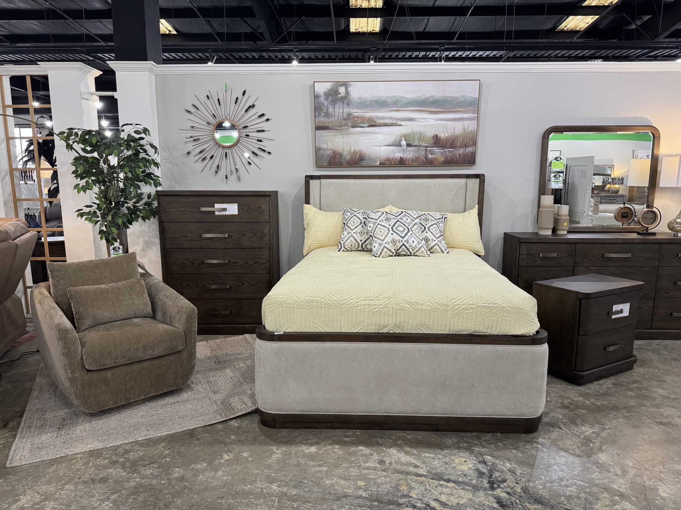 Bedroom staging with armchair, chest and wall clock