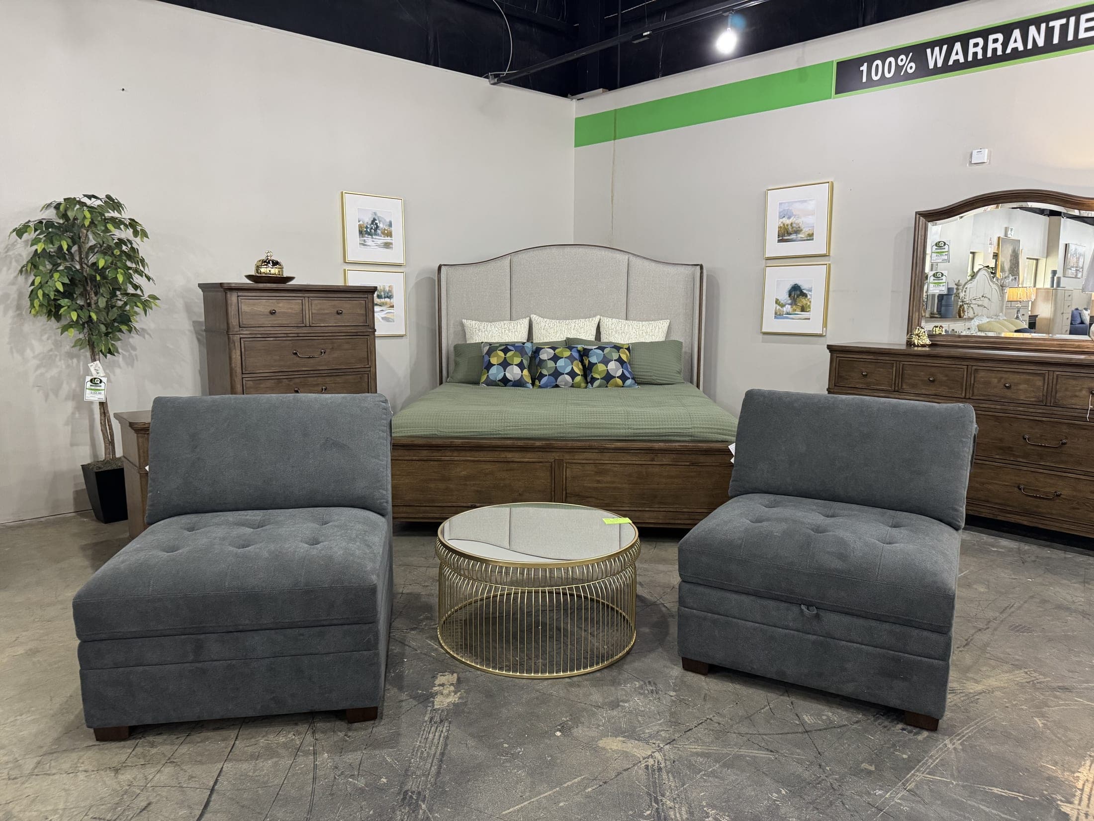 Gray upholstered bed with matching bench and dresser