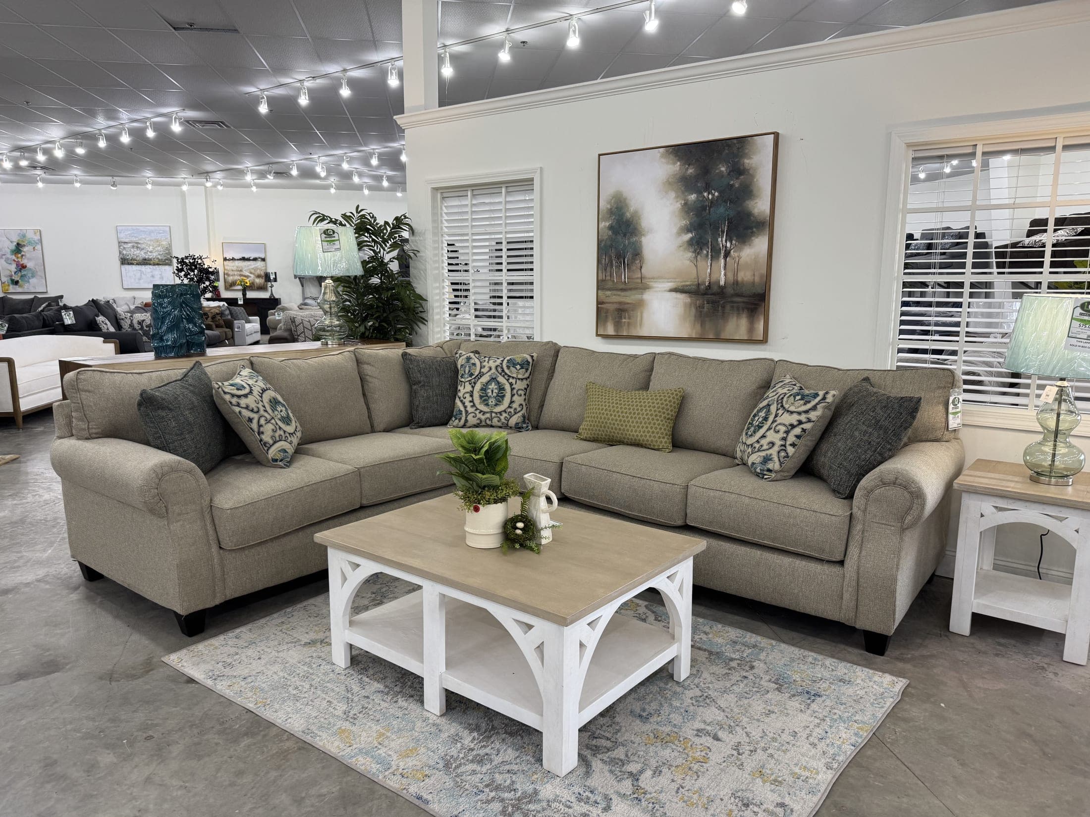 Beige sofa with white farmhouse coffee table