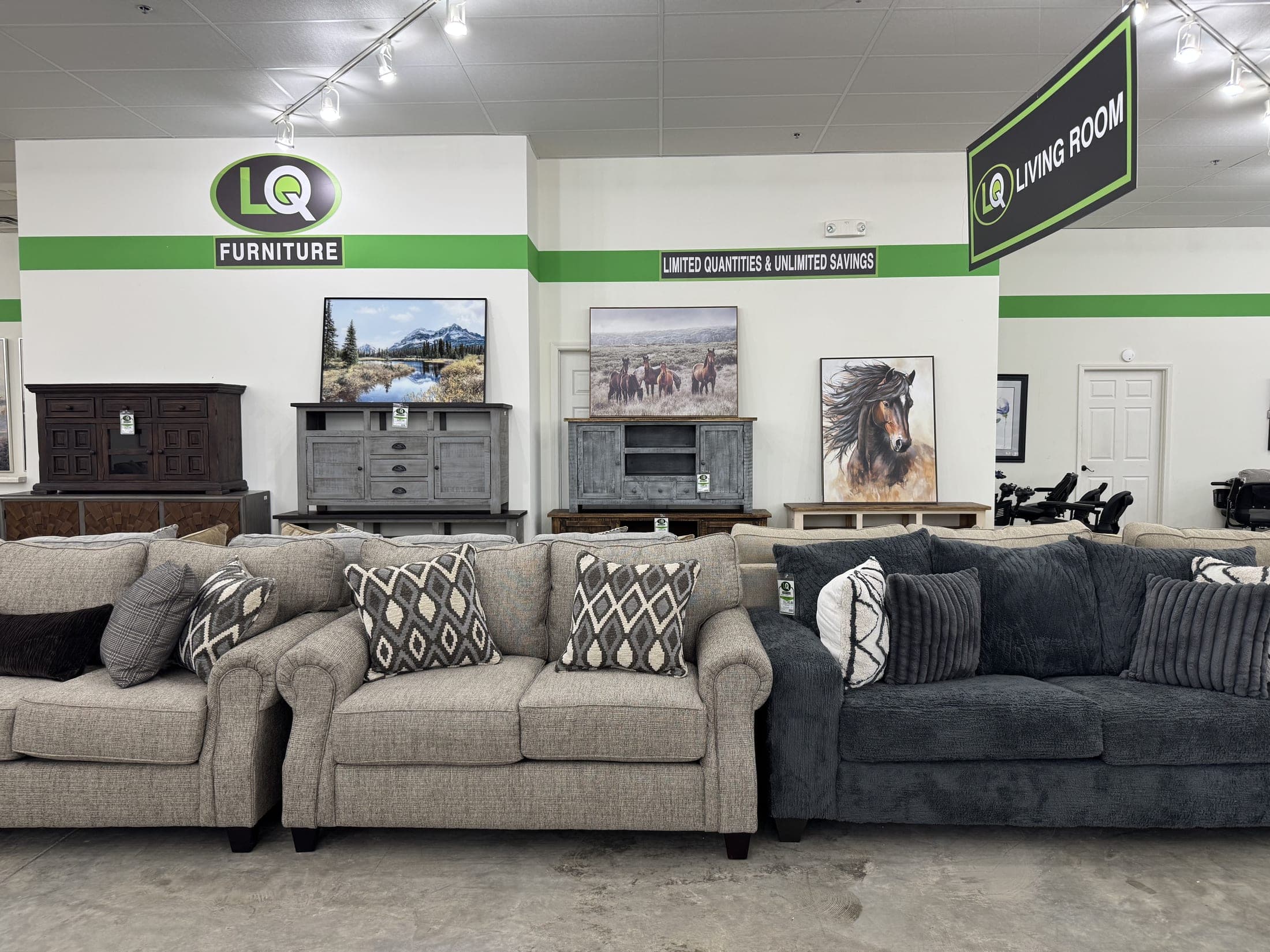 Pair of gray sofas with patterned accent pillows